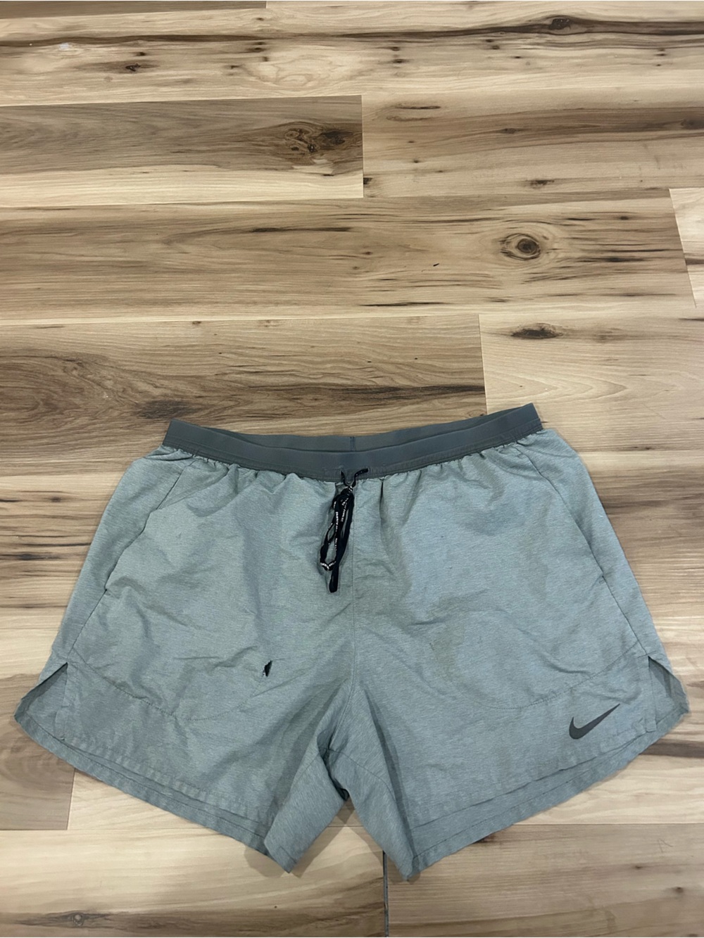 Nike Light gray 5 inch running shorts.